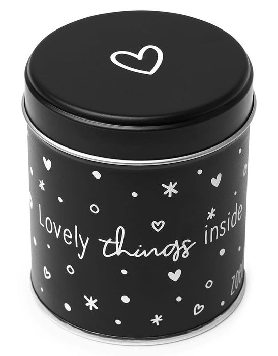 Gift tin with candle with the text Happiness is enjoying what is there