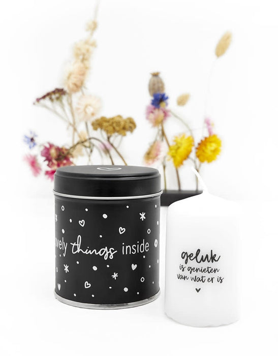 Gift tin with candle with the text Happiness is enjoying what is there